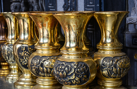 Chiang Mai, Thailand - May 2, 2015. Old Thai brass utensil for sale in a native ancient market in Chiang Mai, Thailand.の写真素材