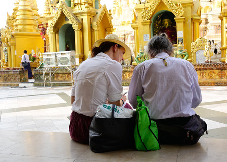 Yangon, Myanmar - Feb 26, 2016. Tourists sitting and relaxing at Shwedagon pagoda in Yangon, Myanmar.のeditorial素材