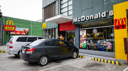 Manila, Philippines - Dec 20, 2015. Cars parking on street at downtown in Manila, Philippines.のeditorial素材