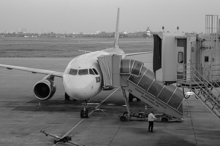 Saigon, Vietnam - Dec 14, 2015. Airplane docking in Tan Son Nhat International Airport. Tan Son Nhat...
