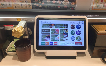 Tokyo, Japan - Jan 1, 2016. Order sushi by tablet at the restaurant in Tokyo, Japan.