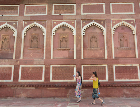 Agra, India - Jul 13, 2015. Indian women visit Agra Fort, World Heritage site. The fort was built by the Mughals, can be more accurately described as a walled city in Agra, India.のeditorial素材