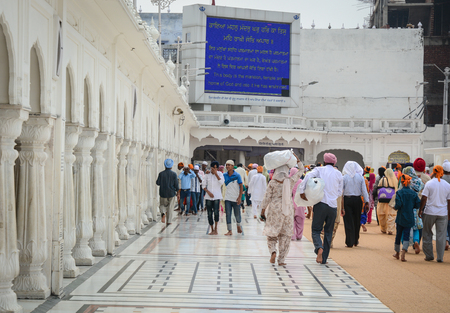 Amritsar, India - Jul 25, 2015. Indian people visit the Golden Temple in Amritsar, India. Amritsar was founded in 1577 by the fourth Sikh guru.のeditorial素材