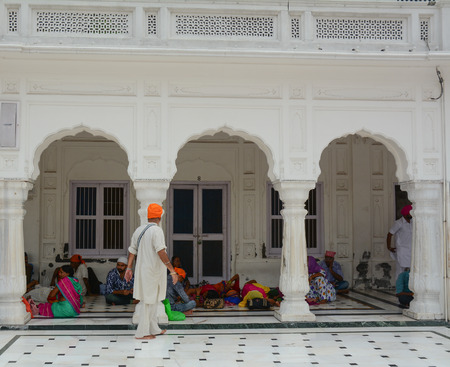 Amritsar, India - Jul 25, 2015. Indian people relaxing at the Golden Temple in Amritsar, India. Golden Temple is the holiest Gurdwara of Sikhism.のeditorial素材