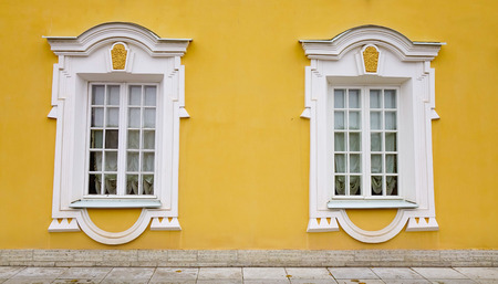 Windows with yallow wall in Saint Petersburg, Russia.の写真素材