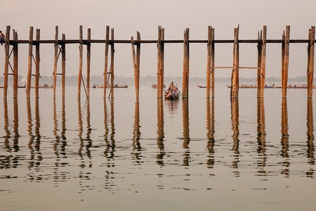 Mandalay, Myanmar - Feb 20, 2016. Tourists looking at the Ubein bridge at sunset in Mandalay, Myanmar.のeditorial素材