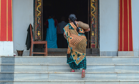 Bodh Gaya, India - Jul 9, 2015. Indian women coming to the Mahabodhi Temple in Bodh Gaya, India.のeditorial素材