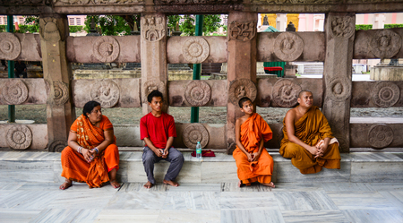 Bodhgaya, India - Jul 9, 2016. Monk sitting at Mahabodhi Temple in Bodhgaya, India.のeditorial素材