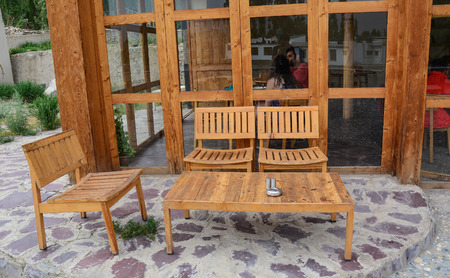 Ladakh, India - Jul 17, 2015. Wooden chairs and tables at restaurant in Ladakh, state of Jammu and Kashmir, India.のeditorial素材