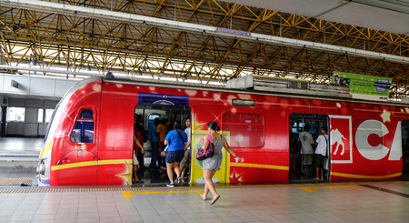 Manila, Philippines - Dec 20, 2015. People coming to LRT train at EDSA train station in Manila, Philippines. LRT serves 579,000 passengers each day.のeditorial素材