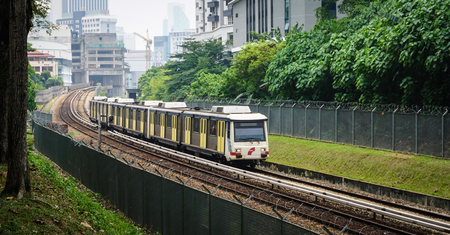 Kuala Lumpur, Malaysia - Jun 6, 2015. A train running on track in Kuala Lumpur, Malaysia. Kuala Lumpur metro consists of 6 metro lines operated by 4 operators.のeditorial素材