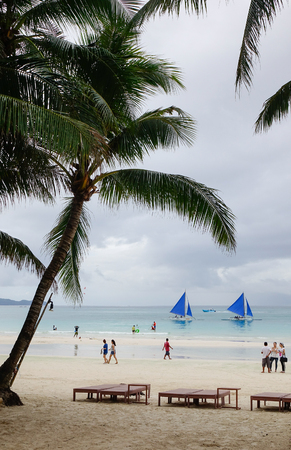 Boracay, Philippines - Dec 17, 2015. People on White beach with plam trees in Boracay, Philippines. Boracay Island has received awards from numerous travel publications and agencies.のeditorial素材