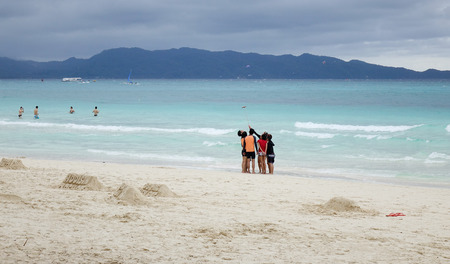 Boracay, Philippines - Dec 17, 2015. Tourists on White beach in Boracay, Philippines. Leisure activities available on or near Boracay include scuba diving, diving helmet, snorkeling.のeditorial素材