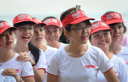 Vung Tau, Vietnam - June 30, 2015. Unidentified young women in the uniform playing a team sport game on the beach in Vung Tau, southern Vietnam.のeditorial素材
