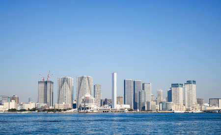 Tokyo, Japan - Jan 4, 2016. Many modern office buildings located at business district in Tokyo, Japan. View from Odaiba, Tokyo Bay.のeditorial素材
