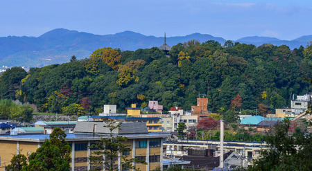 Mountain scene with many building at autumn in Kyoto, Japan. View from top of the hill.の写真素材