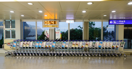 Taipei, Taiwan - Nov 23, 2016. Trolleys at Departure Terminal of Taoyuan Airport, Taipei, Taiwan. Taoyuan is an important regional trans-shipment center, passenger hub, and gateway for destinations in Asia.のeditorial素材