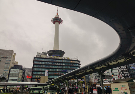 Kyoto, Japan - Nov 27, 2016. Kyoto Tower in front of JR Station in Kyoto, Japan. The tower is the tallest in Kyoto, height of 131 meters. JR Station is the city's transportation hub.のeditorial素材