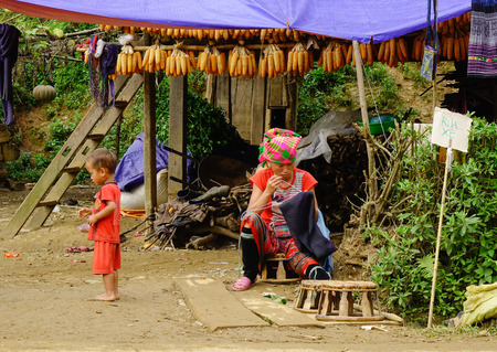 Sapa, Vietnam - Sep 26, 2016. Unidentified Hmong woman sewing in Sapa, Vietnam. The Hmong are an Asian ethnic group from the mountainous regions of China, Vietnam and Laos.のeditorial素材