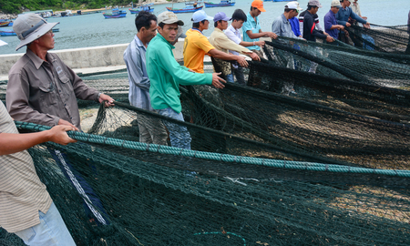 Ninh Thuan, Vietnam - Jan 27, 2016. People working with fishing nets in the village in Vinh Hy Bay, Phan Rang, Vietnam. Phan Rang is one of famous destinations in southern Vietnam.のeditorial素材