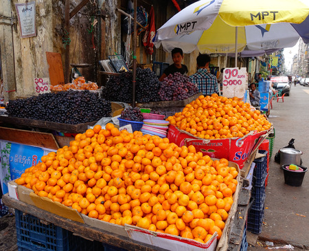 Mandalay, Myanmar - Feb 26, 2016. Burmese people selling fruits at market in Mandalay, Myanmar. Mandalay is the second-largest city and the last royal capital of Myanmar (Burma).のeditorial素材