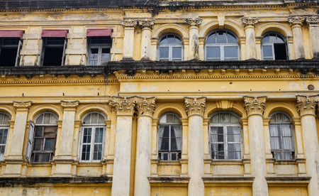 Yangon, Myanmar - Feb 26, 2016. Facade of old British colonial building at Sule Boulevard in Yangon, Myanmar. Sule Boulevard are the busiest street in Yangon.のeditorial素材