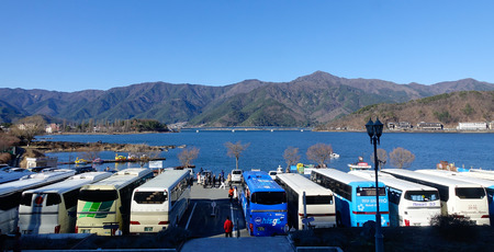 Yamanashi, Japan - Jan 1, 2016. Many tourist buses parking at Kawaguchi township in Japan. Lake Kawaguchi is located in southern Yamanashi near Mount Fuji, Japan.のeditorial素材