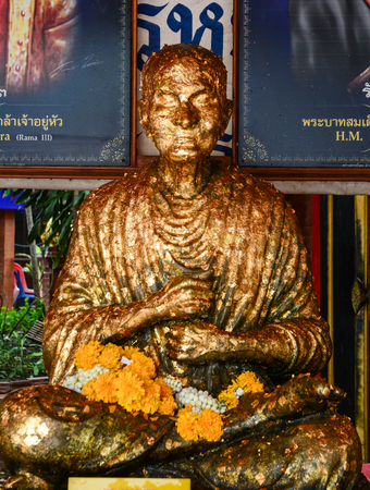 BANGKOK, THAILAND - JUL 30, 2015. Golden monk statue in Wat Mahathat in Bangkok, Thailand. Mahathat is one of the 10 royal temples of the highest class in Bangkok.のeditorial素材