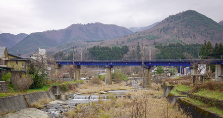 Yamadera, Japan - Dec 5, 2016. The highway with mountain background in Yamadera, Japan. Yamadera is a scenic temple located in the mountains northeast of Yamagata.