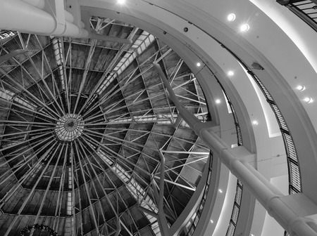 Inside of the dome of a modern city shopping mall. Black and white image.のeditorial素材