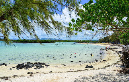 Mahebourg, Mauritius - Jan 7, 2017. People enjoy on the beach in Mahebourg, Mauritius. The environment in Mauritius is typically tropical in the coastal regions.のeditorial素材