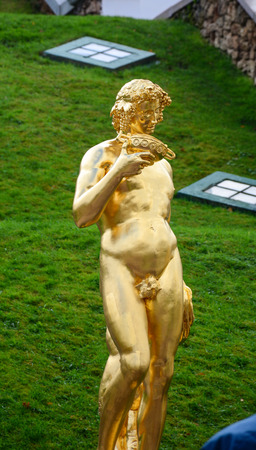 St Petersburg, Russia - Oct 9, 2016. A golden statue at Lower Garden in Peterhof Palace, Saint Petersburg, Russia. The Peterhof Museum is one of the most popular museums in Russia.のeditorial素材