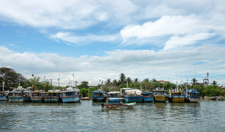 Colombo, Sri Lanka - Sep 5, 2015. Many fishing boats docking in pier at sunny day in Colombo countryside, Sri Lanka. Colombo is the largest city of Sri Lanka.のeditorial素材