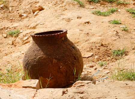 An old ceramic pot on rural road in Bagan, Myanmar.の写真素材