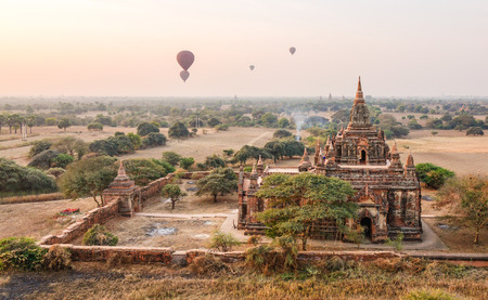 South Guni Temple with hot air balloons at sunny day in Bagan, Myanmar. Bagan is an ancient city in central Myanmar (formerly Burma), southwest of Mandalay.のeditorial素材