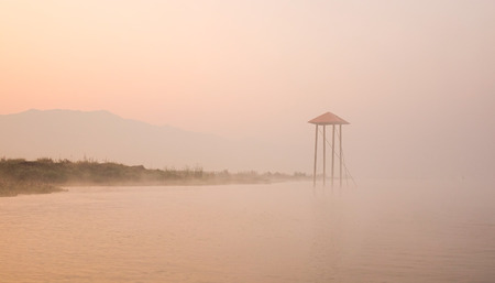 Landscape of Inle Lake at the sunrise with fog in Shan State, Myanmar.の写真素材