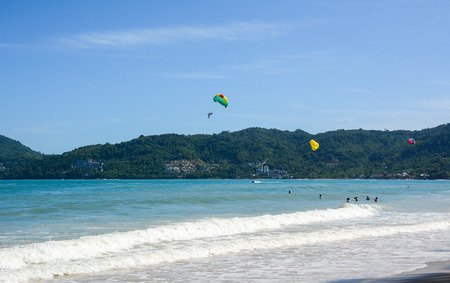 Tourists enjoying on the Patong beach in Phuket, Thailand. Phuket is known as one of the popular tourist spot in Thailand.の写真素材