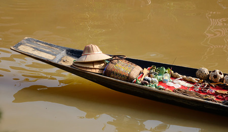 Wooden boat carrying souvenirs for sale on the canal in Inle, Myanmar. Inle Lake is a freshwater lake located in the Nyaungshwe Township of Shan State.の写真素材