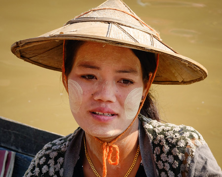 INLE LAKE, MYANMAR - FEB 15, 2015. Portrait of young Burmese woman in Inle Lake, Myanmar. Inle is one of the highest lakes at an elevation of 2,900 feet (880m).のeditorial素材