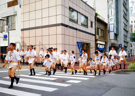 Foukoka, Japan - Jul 10, 2015. Men walking on street at Hakata Gion festival in Foukoka, Japan. The Hakata Gion Yamakasa is one of the most interesting festivals in Japan.のeditorial素材