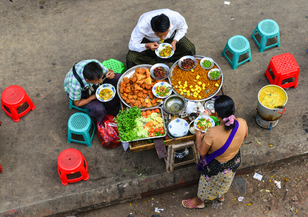 Yangon, Myanmar - Feb 1, 2017. People eating street food in Yangon, Myanmar. Yangon is the country largest city with a population above seven million.のeditorial素材