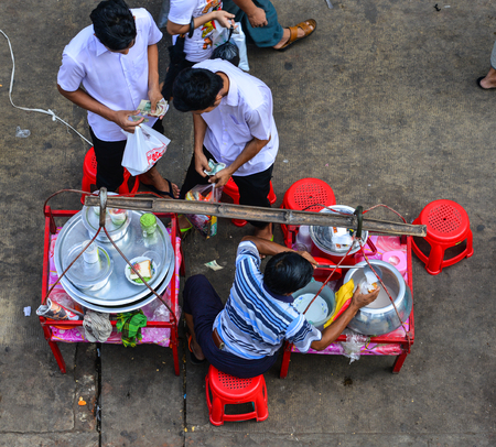 Yangon, Myanmar - Feb 1, 2017. Burmese people selling street food in Yangon, Myanmar. Yangon is the most important commercial centre in Myanmar.のeditorial素材