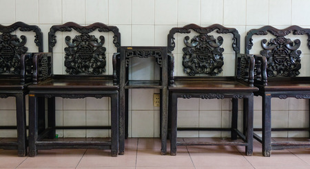 Chinese-style wooden chairs at living room in a temple in Saigon, Vietnam.の写真素材