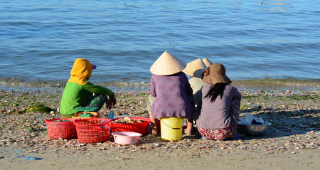Phan Thiet, Vietnam - Mar 19, 2016. People at Mui Ne fishing market in Phan Thiet, Vietnam. Mui Ne is a beach resort town along the South China Sea in Southeast Vietnam.のeditorial素材