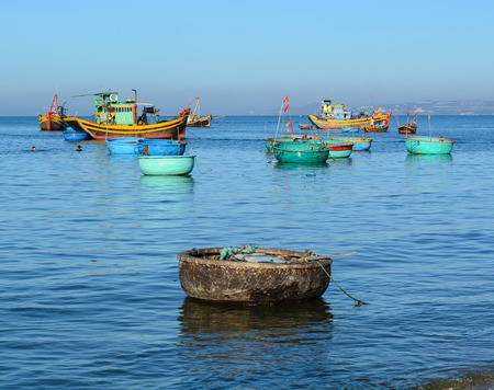Phan Thiet, Vietnam - Mar 19, 2016. Basket boats docking at Mui Ne village in Phan Thiet, Vietnam. Mui Ne is a beach resort town along the South China Sea in Southeast Vietnam.のeditorial素材