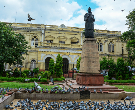 Mahatma Gandhi statue with many pigeons in the center of Old Delhi, India. Delhi is the capital of India and the second most populated city in the country.のeditorial素材