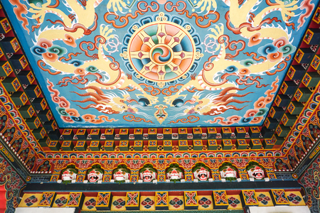 Inside of the traditional Bhutanese Buddhist temple in Bodhgaya, India. Bodh Gaya is the most revered of all Buddhist sacred sites.のeditorial素材