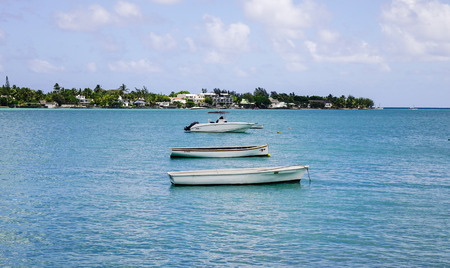 Grand Baie, Mauritius - Jan 11, 2017. Speed boats docking on the sea in Grand Baie, Mauritius. Mauritius is known for its beaches, lagoons and reefs.のeditorial素材