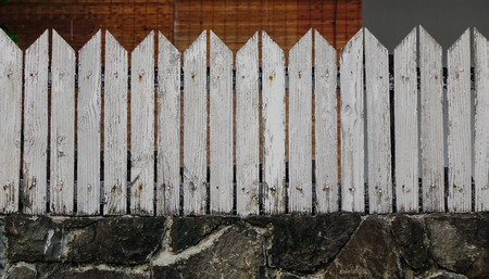 Wooden fence with stone wall at the ancient building in Grand Baie, Mauritius.の写真素材