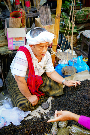 Yangon, Myanmar - Oct 17, 2015. A man sells tea leaves at the Bogyoke Market in Yangon, Myanmar. Bogyoke is a major bazaar located in Pabedan township in central Yangon.のeditorial素材